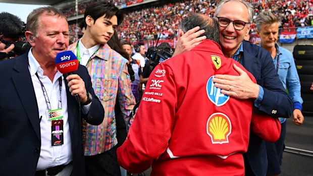 A man walks through the F1 grid. 
