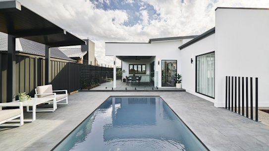 A boy has died after being found unresponsive in a G.J Gardner display home pool