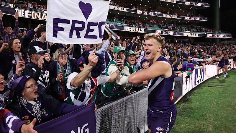 At any cost: Freo faithful make pilgrimage east for historic grand final