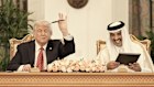 Donald Trump and Sheikh Tamim at a signing ceremony in Doha.