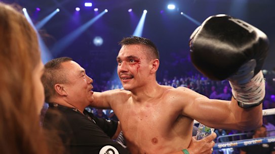 Tim Tszyu celebrates with his trainer after defeating Dennis Hogan in Newcastle.