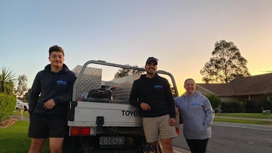 Instant shutdown: Crhis and Kaylee Wilson, right, with their building apprentice Nathan Stamboulie,
