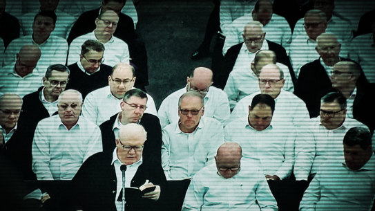 Bruce Hales (front left), the global leader of the Plymouth Brethren Christian Church, preaches in the US.