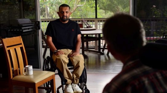 Dr Dinesh Palipana sitting for Brisbane-based painter Brett Poulsen. 