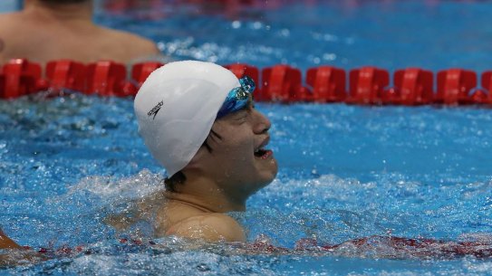 China's Sun Yang is emotional after he wins gold and breaks the world record in the men's 1500m freestyle.