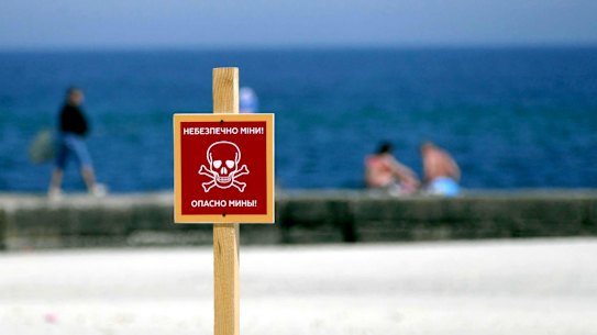 The ‘Danger Mines’ warning sign is pictured at a local beach in Odesa, southern Ukraine.