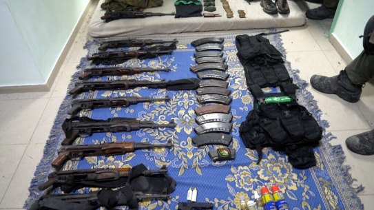 Weapons and other equipment that Israel’s army says it found at Al Shifa Hospital complex in the Gaza Strip.