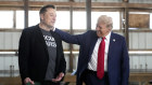 Tesla and SpaceX CEO Elon Musk, left, and Donald Trump attend a campaign event at the Butler Farm