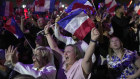 Supporters of France’s Marine Le Pen celebrate National Rally’s result.