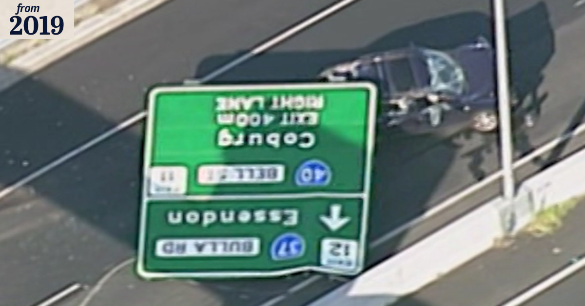 Sign fall: Tullamarine Freeway sign falls and crushes car, injuring woman