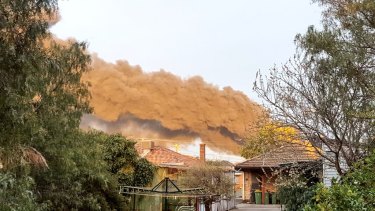 Smoke billows from a West Footscray factory, seen from Kingsville. 
