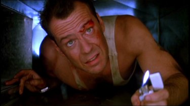 John McClane (Bruce Willis) in Die Hard.