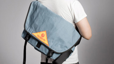 Crumplers first bag was designed to make it easier to carry a beer slab home on your bike.