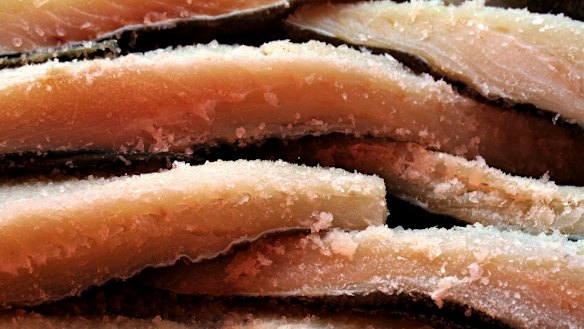 The boy's grandmother was cooking salted cod before he died.