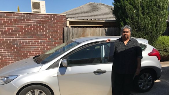 Nalini Devi Thiruvangadam with the car she bought that triggered a downward financial spiral.