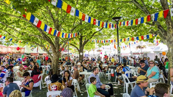 People rest in the shade at the Multicultural Festival.
