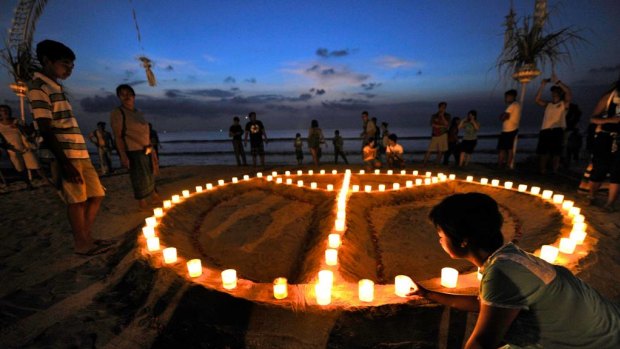 Peace sign made in the sand on Kuta beach to mark the 10th Anniversary of the Bali Bombing.