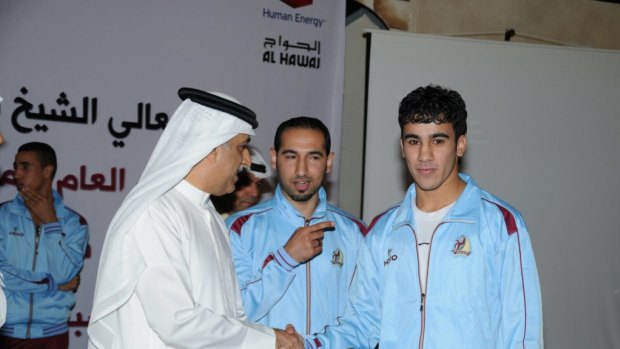 Hakeem AlAraibi with AFC president Shiekh Salman, a member of the royal family who AlAraibi has been critical of in the past.