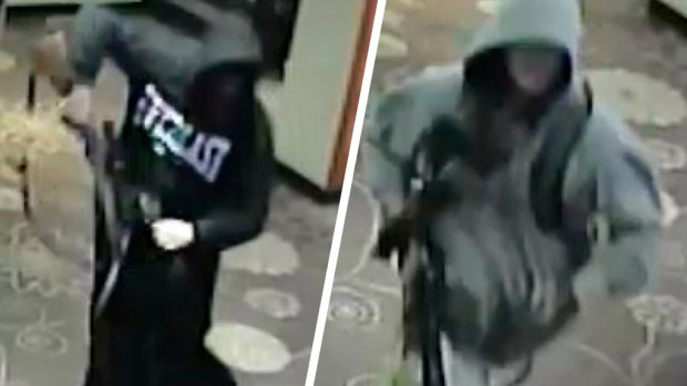 Two men caught in CCTV robbing a gaming venue last March. 