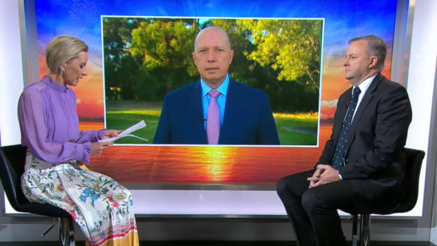 Signing off ... Anthony Albanese with Peter Dutton (on screen) on the Today Show in June.