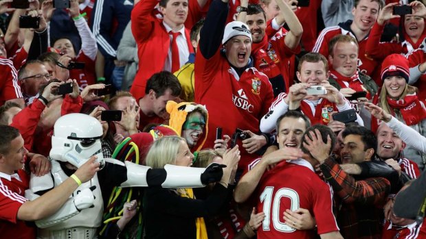 Jonathan Sexton celebrating with the Lions fans after winning the third Test against the Wallabies in 2013.