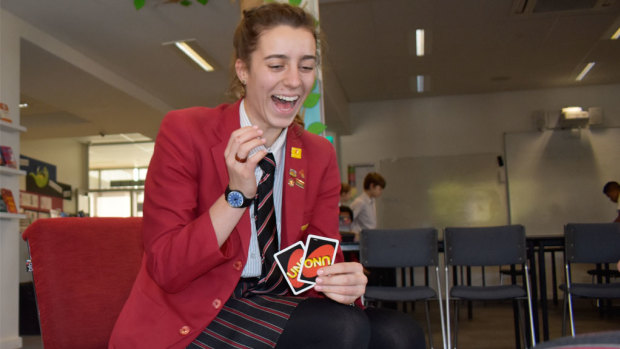 No phone in sight: Hannah Thomas plays Uno at Auburn High School in Hawthorn East.