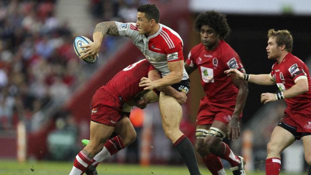 Sonny Bill Williams is tackled by Reds player Anthony Faingaa in the 2011 decider. 