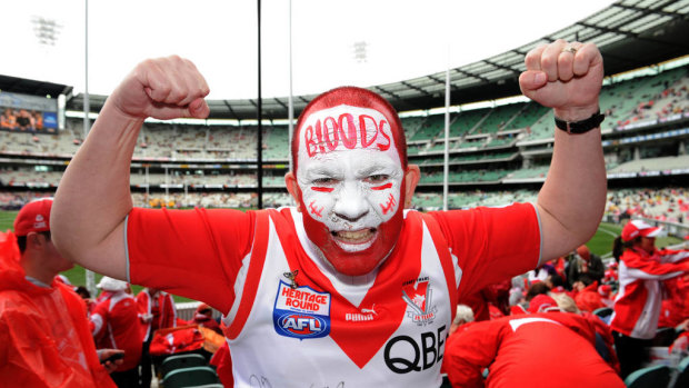 Sydney Swans supporter Peter Maguire (aka Wombat) in among the cheer squad before the 2012 grand final.
