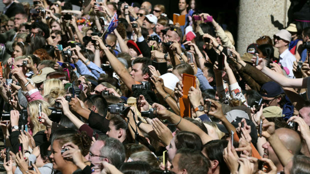 Crowds of well-wishers try to capture images of Prince William and the Duchess of Cambridge during their visit to Sydney.