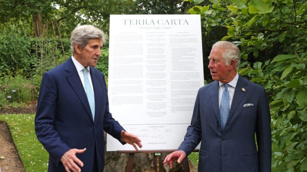 Secretary John Kerry and Prince Charles, Prince of Wales talk in front of the Terra Carta at St James Palace on June 10, 2021 in London, England.