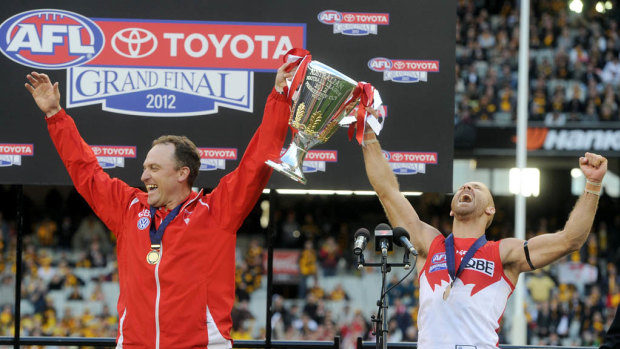 Cheer, cheer: John Longmire coached the Swans to a flag in his second season in 2012.
