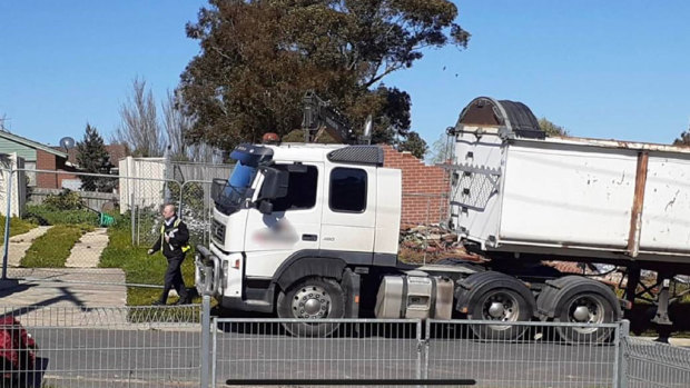 The wall collapsed as the house was being demolished on Wednesday morning.