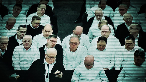 Bruce Hales (front left), the global leader or the Plymouth Brethren Christian Church, preaching in the US.