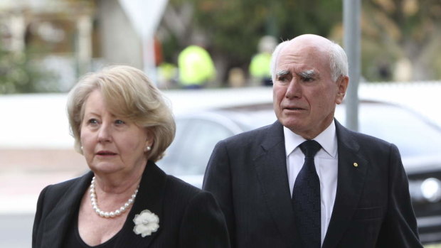 John and Jeanette Howard arrive at the funeral of Paul Ramsay at St Thomas Aquinas Church, Bowral.