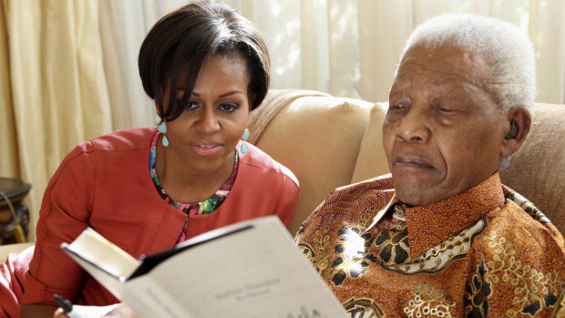 Michelle Obama meets former  South African president, Nelson Mandela, 92, at his home in Houghton in 2011. President Obama was unable to attend due to commitments in Washington.