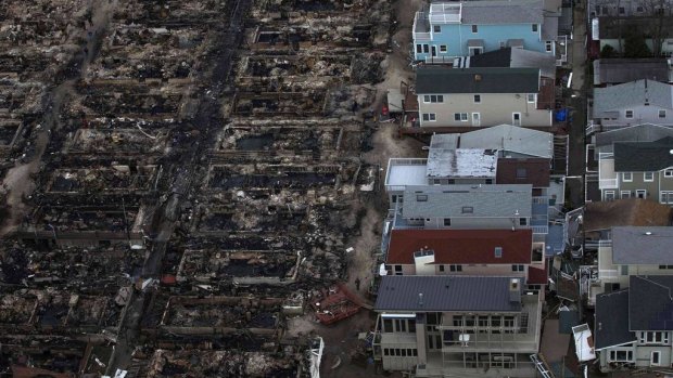 Burned houses are seen next to those which survived in Breezy Point, a neighborhood located in the New York City borough of Queens, after Hurricane Sandy in 2012.