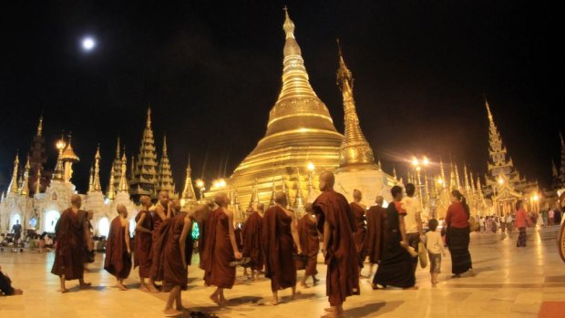 Buddhist monks outside Myanmar's landmark Shwedagon Pagoda.