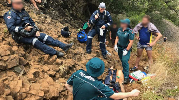 A RACQ LifeFlight Rescue helicopter was called to winch a man from the Table Top Mountain after he fell about 10 metres while hiking with friends on Sunday.