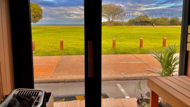 A view from inside the sauna, overlooking the beach.