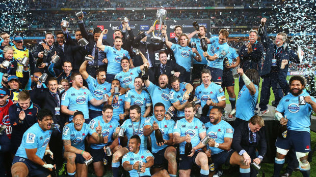 The Waratahs celebrate after beating the Crusaders in the 2014 Super Rugby final. Skelton is bottom left. 