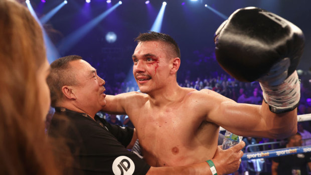Tim Tszyu celebrates with his grandfather Boris after defeating Dennis Hogan in Newcastle.