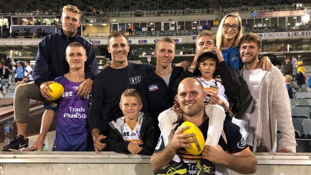 Lachlan McCaffrey with his siblings after a Brumbies game.