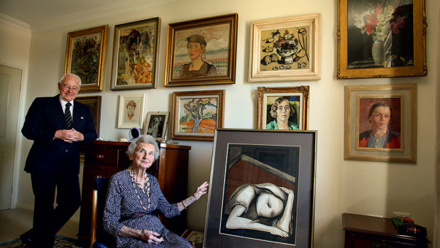 Sheila and Jim Cruthers in their apartment with some of her collection.