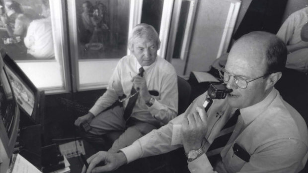 Richie Benaud and Tony Greig (right) at work for Channel 9 at the Melbourne Cricket Ground.
