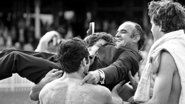 South Sydney coach Clive Churchill is held aloft by his players after their premiership win in 1971.