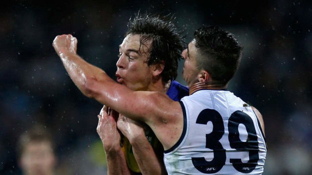 Liam Picken marks the ball in front of Geelong’s Shane Kersten in a 2016 game.