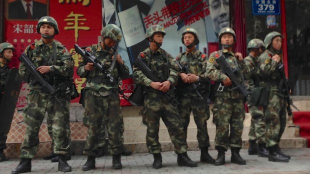 A paramilitary police patrol in Xinjiang.