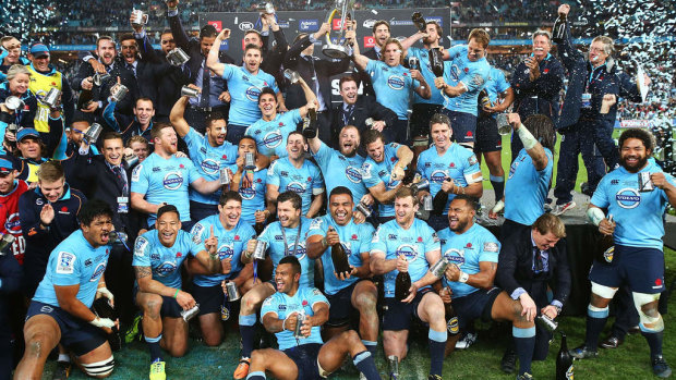 The Waratahs celebrate after beating the Crusaders in the 2014 Super Rugby final. 