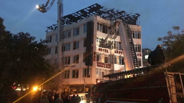 Rescued hotel guest Sivanand Chand photographed firefighters rescuing people during the early morning fire at the Arpit Palace Hotel in Delhi.