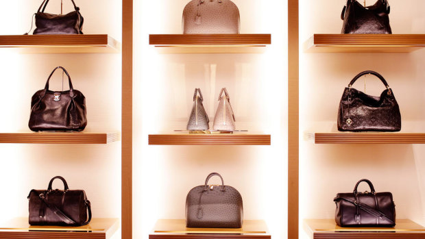 Leather goods sit on display at the Louis Vuitton "maison" flagship store, a unit of LVMH Moet Hennessy Louis Vuitton SA.